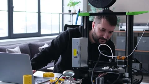 Thoughtful Man Designer Control Work Of A 3D Printer Stock Footage 266787030
