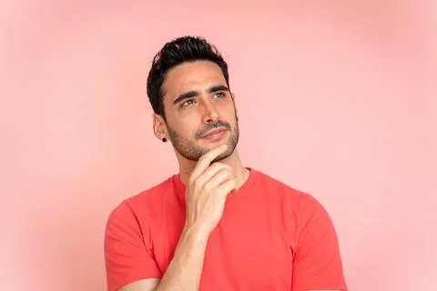 Thoughtful man looking away in studio shot. Stock Photos