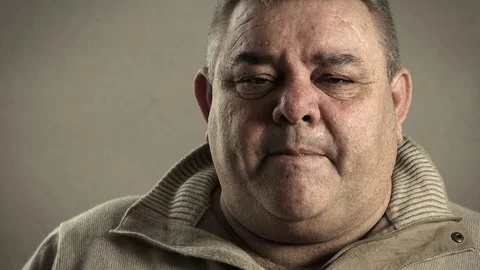 Thoughtful man looking in camera: isolated pensive man portrait Stock Footage 72403969