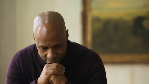 Thoughtful man looking down at the ground. Видео 88405962