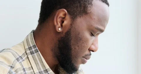 Thoughtful man looking out through window Video stock 156520953