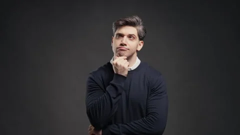 Thoughtful man looking upward while searching for idea or making an important de Stock Footage 341765052