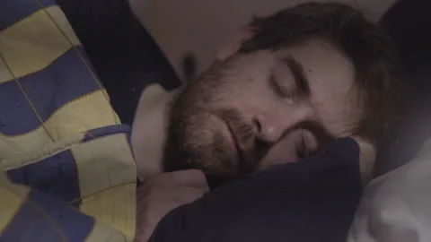 Thoughtful Man Is Lying On His Bed About To Sleep Stock Footage 137441576