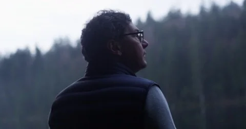 Thoughtful man in nature 動画素材 76233775