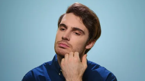 Thoughtful man posing in studio. Close up serious guy thinking problem solution Stock Footage 129141851