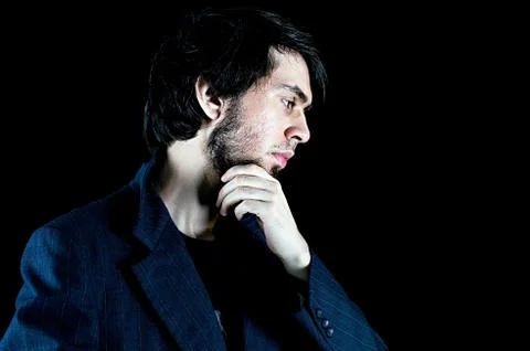A thoughtful man from a side angle shot Stock Photos