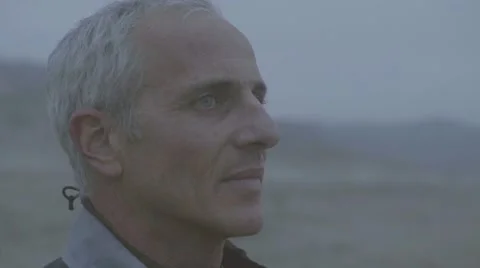 Thoughtful man standing on beach Stock Footage 63465311
