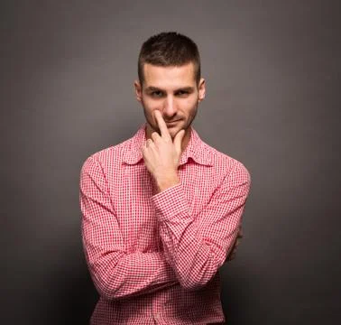 Thoughtful man in studio Stock Photos