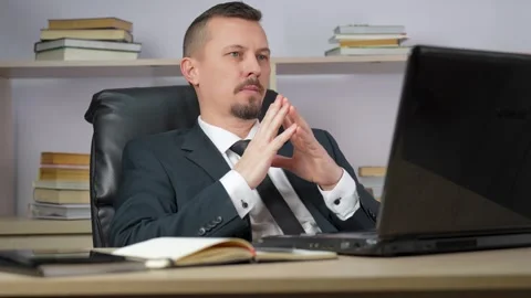 Thoughtful man thinking of problem solution working on laptop Stock Footage 273198215