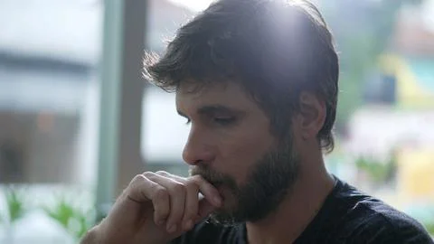 Thoughtful man thinking solution. One pensive person pondering solving hard p Foto stock