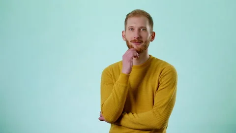 Thoughtful Man Thinking, Touching Beard And Contemplaining, Comparing Decisions Stock Footage 170192150