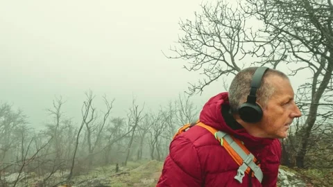 Thoughtful Mature Man Finding Solace in Misty Rainy Landscape Stock-Footage 330911912