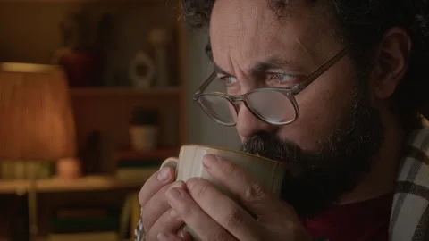 Thoughtful Middle Aged Man Drinking Warm Tea at Night Stock Footage 341676371
