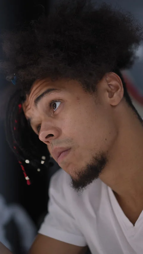 Thoughtful mixed-race man with dreadlocks working intensely Stock Footage 331402969