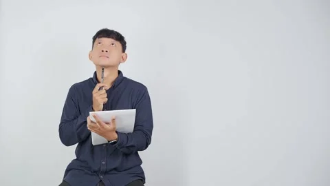 Thoughtful Person Looking Up While Thinking of Answer 库存影片 344830789