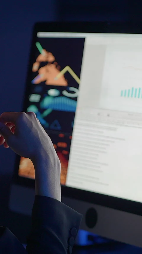 A Thoughtful Professional Analyzing Complex Data on a Computer Screen in Stock Footage 296015448