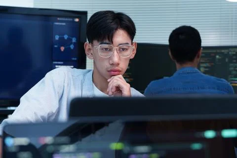 Thoughtful Programmer Developing Digital and AI Technology Stock Photos