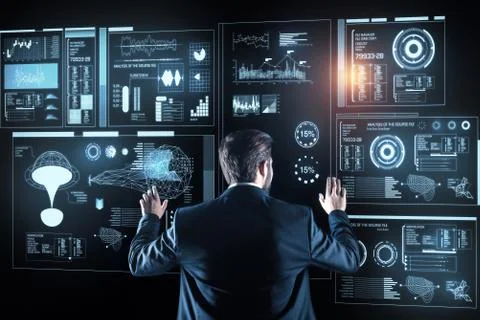 Thoughtful programmer standing and analyzing the information on the screen Stock-Fotos