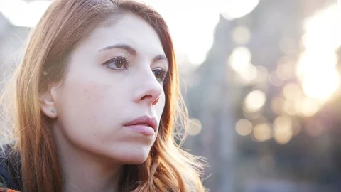 Thoughtful sad red haired young woman in the park.Worries,sadness Stock-Footage 105005202