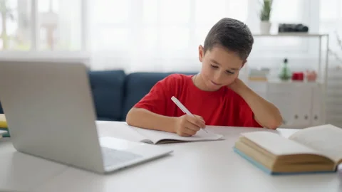 Thoughtful schoolboy having difficulty with homework, complicated math problem Stock Footage 224957170
