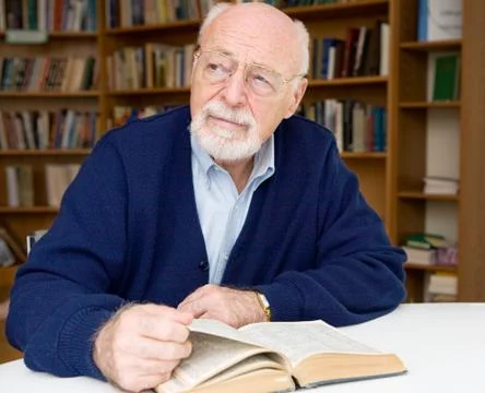 Thoughtful Senior in Library Stock Photos