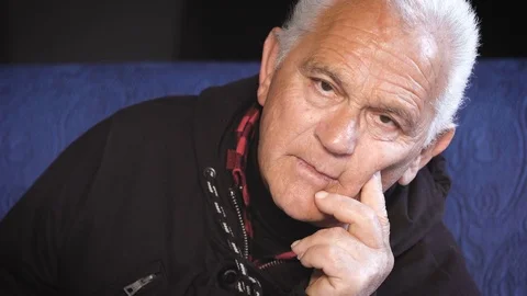 Thoughtful serious old man looking at camera Stock Footage 74701363