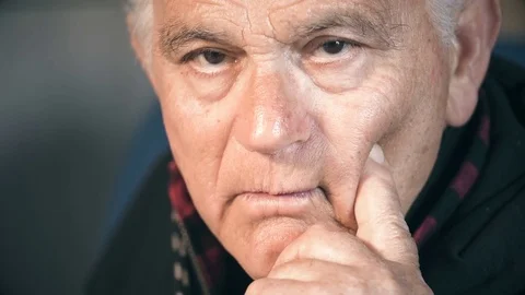 Thoughtful serious old man looking the camera. Portrait of pensive elderly man Stock Footage 74701607