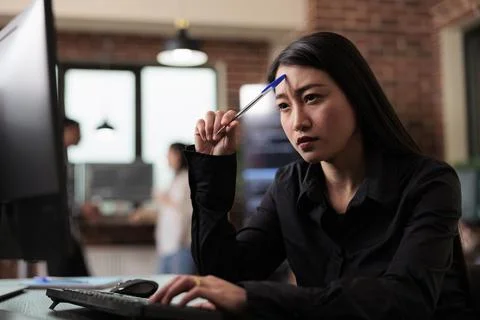 Thoughtful software developer thinking of ways to upgrade encryption program 스톡 사진