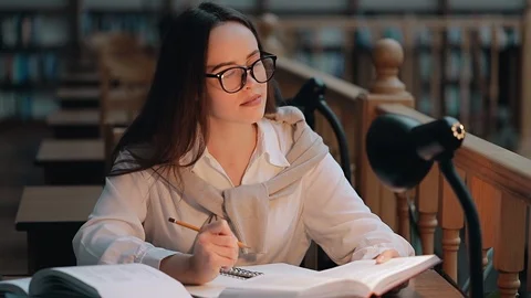 Thoughtful Student Preparing for Exams Видео 103831864