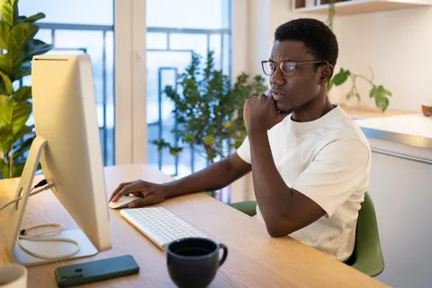 Thoughtful web developer work on computer, programmer trying to find solution Stock Photos