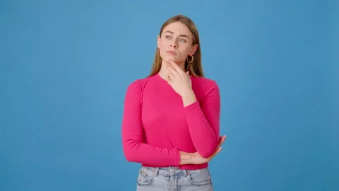 Thoughtful woman brainstorming problem solution in studio Stock Footage 262751499