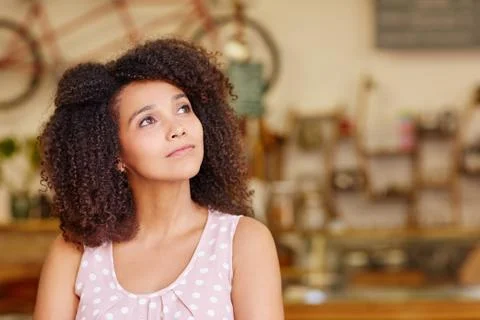 Thoughtful woman looking up and daydreaming Stock Photos