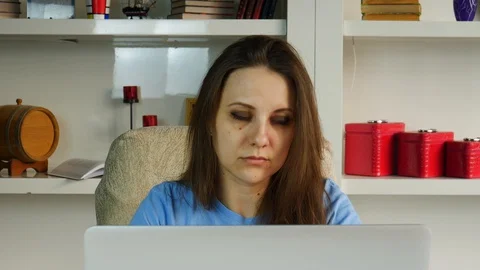 Thoughtful woman working on computer looking away thinking solving problem Stock Footage 129001897