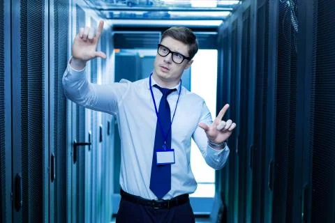 Thoughtful worker near the server cabinets Stock Photos