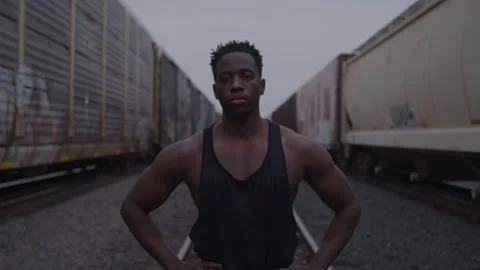 Thoughtful Young Athletic Guy In Train Yard Stock Footage 270327123