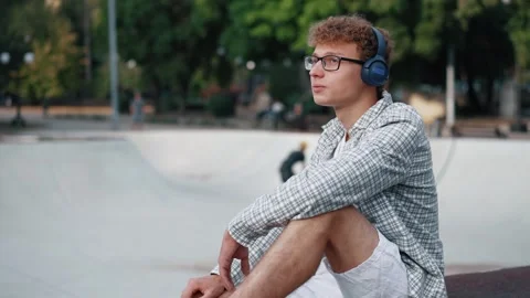 Thoughtful young guy in the park Stock Footage 290847700