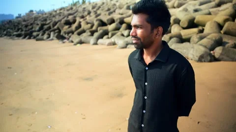 Thoughtful Young Man on the Beach Stock Footage 281323019