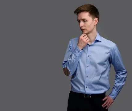 Thoughtful young man looking down Stock Photos