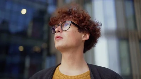 Thoughtful young man standing in wind Stock Footage 139477046