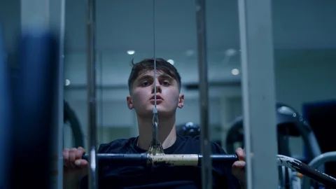 Thoughtful young man working out in the gym Stock Footage