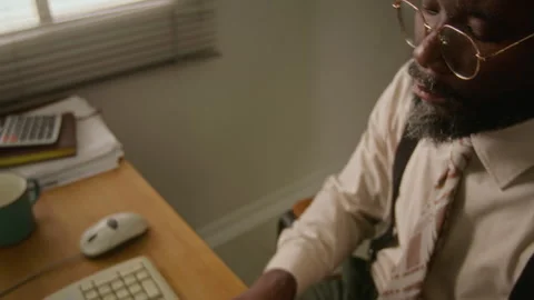 Thoughtful Young Man Working on Retro Computer Stock Footage 341421068