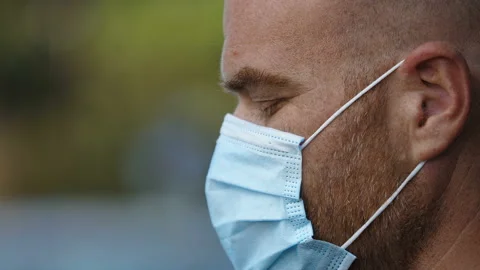 Thoughts, concern - sad man lowers his head and looks down - macro Stock Footage 143255924