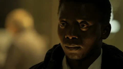 Thoughts, problems - pensive black man raises his head and looks away sighing Video stock 154181108