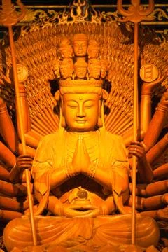 Thousand hands of god image make of wood carving in chinese temple ,thailand Stock Photos