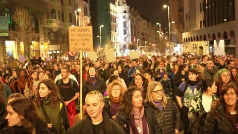 Thousand of people marching during 8M feminist demonstration against machism 스톡 동영상 235340890