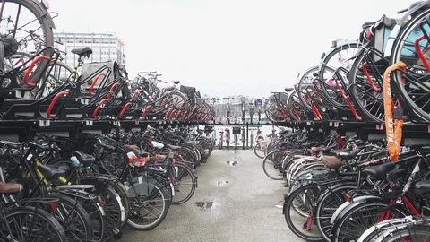 Thousands of bikes at the bike parking space near Amsterdam central station Stock Footage 89731403