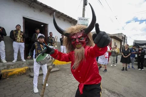 Thousands of devils parade in Diablada Pillarena on the streets of Pillaro in Ec Stock Photos