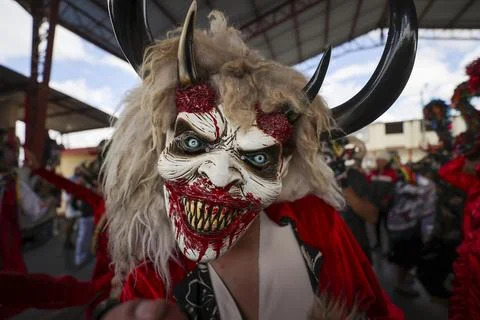 Thousands of devils parade in Diablada Pillarena on the streets of Pillaro in Ec Stock Photos