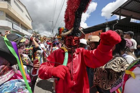 Thousands of devils parade in Diablada Pillarena on the streets of Pillaro in Ec Stock Photos