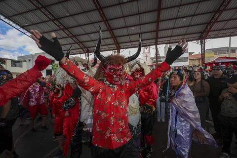 Thousands of devils parade in Diablada Pillarena on the streets of Pillaro in Ec Stock Photos